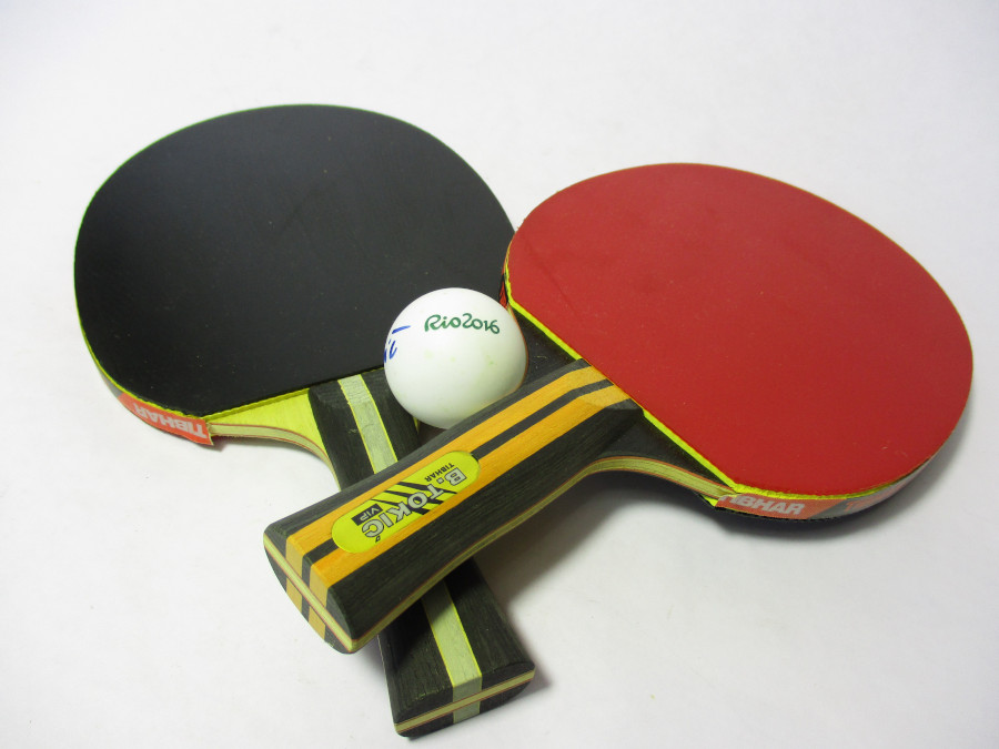 A Racket With A Table Tennis Ball